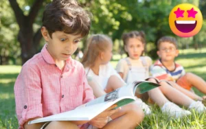 Excited young boy reading a book outdoors with friends — building reading confidence through fun literacy programs